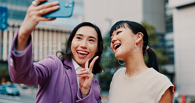 Buy stock photo Business women, selfie and friends in city with smile for peace sign, partner or excited for post on web. People, partnership and photography with memory, happy and icon with profile picture in Japan