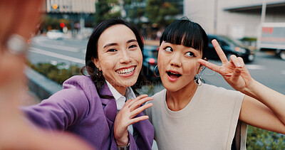 Buy stock photo Women, selfie and together in street, funny and smile with peace sign, excited and comic post on social media. People, outdoor and photography in city, happy and emoji with profile picture in Japan