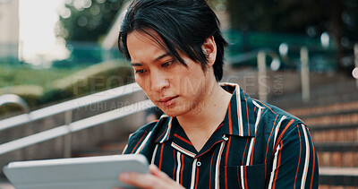 Buy stock photo Japanese man, city and tablet with reading, serious and planning for property or management. Male person, tech and news for growth, investment and opportunity in real estate development as architect