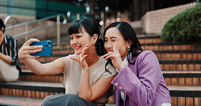 Buy stock photo Business women, selfie and friends on stairs with smile for peace sign, partner or excited for post in city. People, sidewalk and photography with laugh, funny and emoji for profile picture in Japan