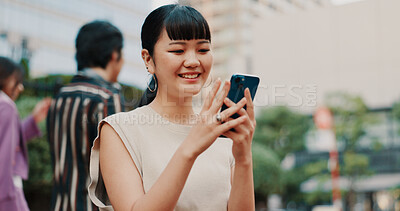Buy stock photo Happy, travel and Asian woman with phone in city for communication, social media and networking. Smile, weekend and person on smartphone for online chatting, mobile app text and website in Japan