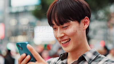 Buy stock photo Man, phone and happy with travel in city, reading and check notification with chat, laugh or meme in street. Person, smartphone and outdoor on metro sidewalk, smile and app for social media in Japan