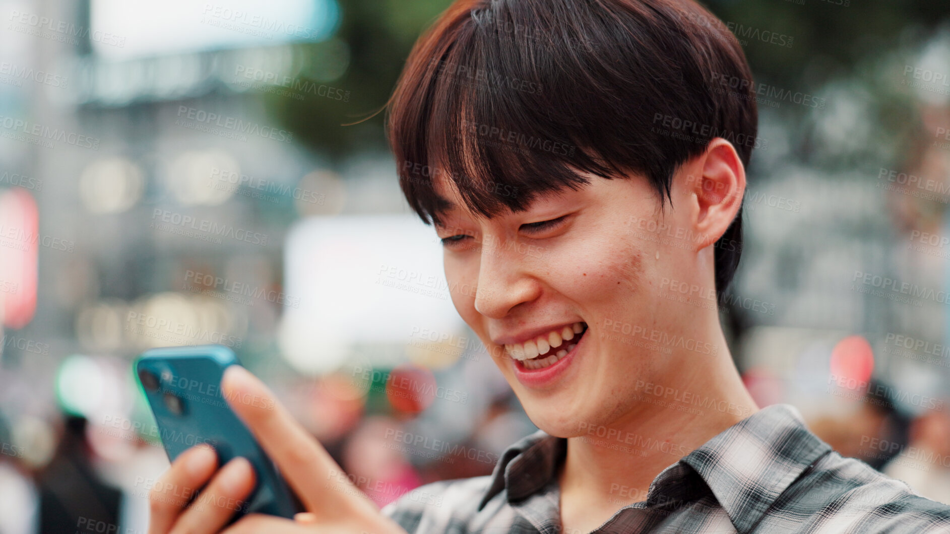 Buy stock photo Man, phone and happy with travel in city, reading and check notification with chat, laugh or meme in street. Person, smartphone and outdoor on metro sidewalk, smile and app for social media in Japan