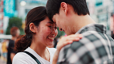 Buy stock photo Love, happy couple and forehead touch outdoor for support, loyalty and commitment on vacation. Japanese man, woman and embrace for romantic relationship, connection and trust partner on date in city