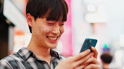 Buy stock photo Man, phone and smile with travel in city, reading and check notification with chat, laugh or meme in street. Person, smartphone and outdoor on metro sidewalk, happy and app for social media in Japan
