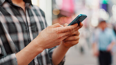 Buy stock photo Hands, phone and person typing in city to check text, social media or blog post on account in Japan. Closeup, mobile or online outdoor for communication, notification or download chat app on internet