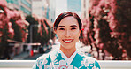 City, smile and portrait of girl with kimono, confidence and outdoor sightseeing adventure in traditional fashion. Urban culture, identity and woman in Japanese clothes, happy face and morning travel