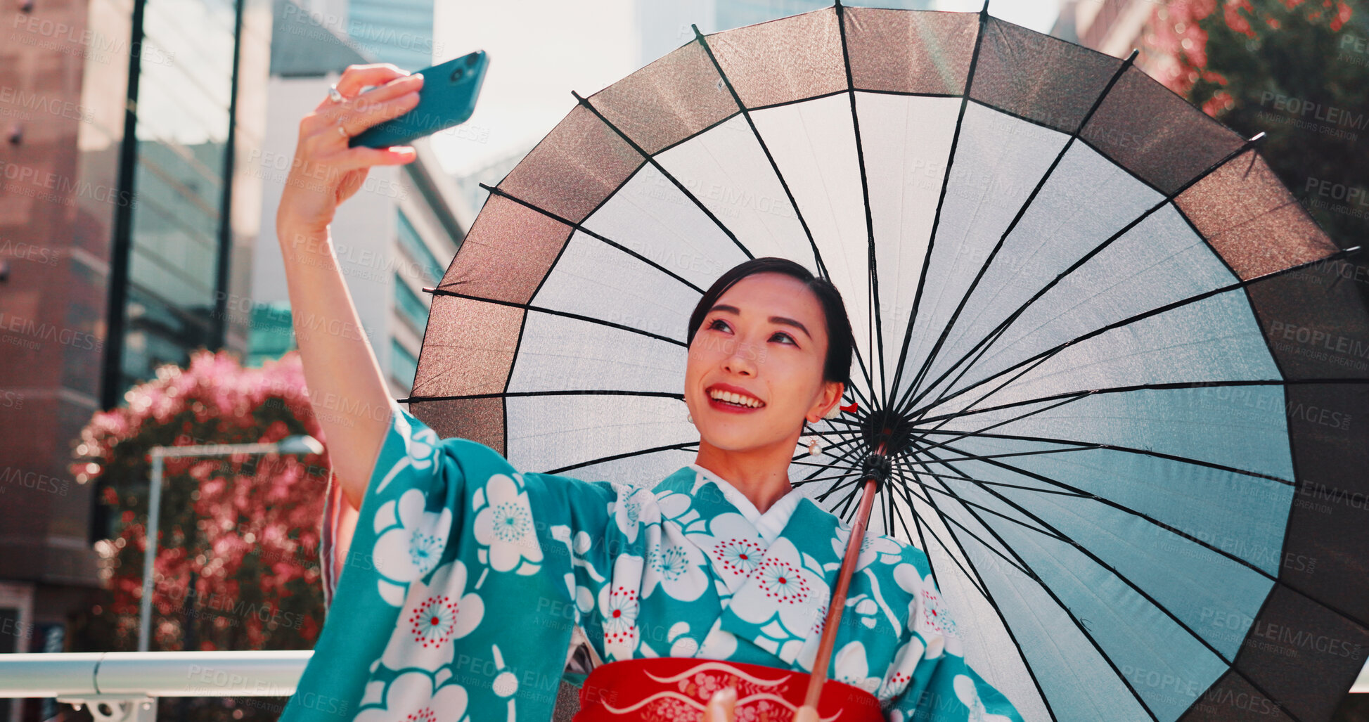 Buy stock photo Japan, selfie and woman in city, umbrella and fashion with traditional clothes. Happiness. person and girl with digital app, parasol and trendy outfit with culture, influencer and cheerful with style