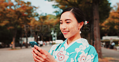 Buy stock photo Cellphone, travel and Japanese woman in city with traditional kimono networking on social media. Happy, phone and female person with cultural dress for stylish outfit in town for journey with contact