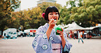 Slushie, holiday and Japanese woman in city with traditional kimono for dessert or sweet treat. Journey, happy and person with shaved ice snack with cultural dress for fashion in town for travel.