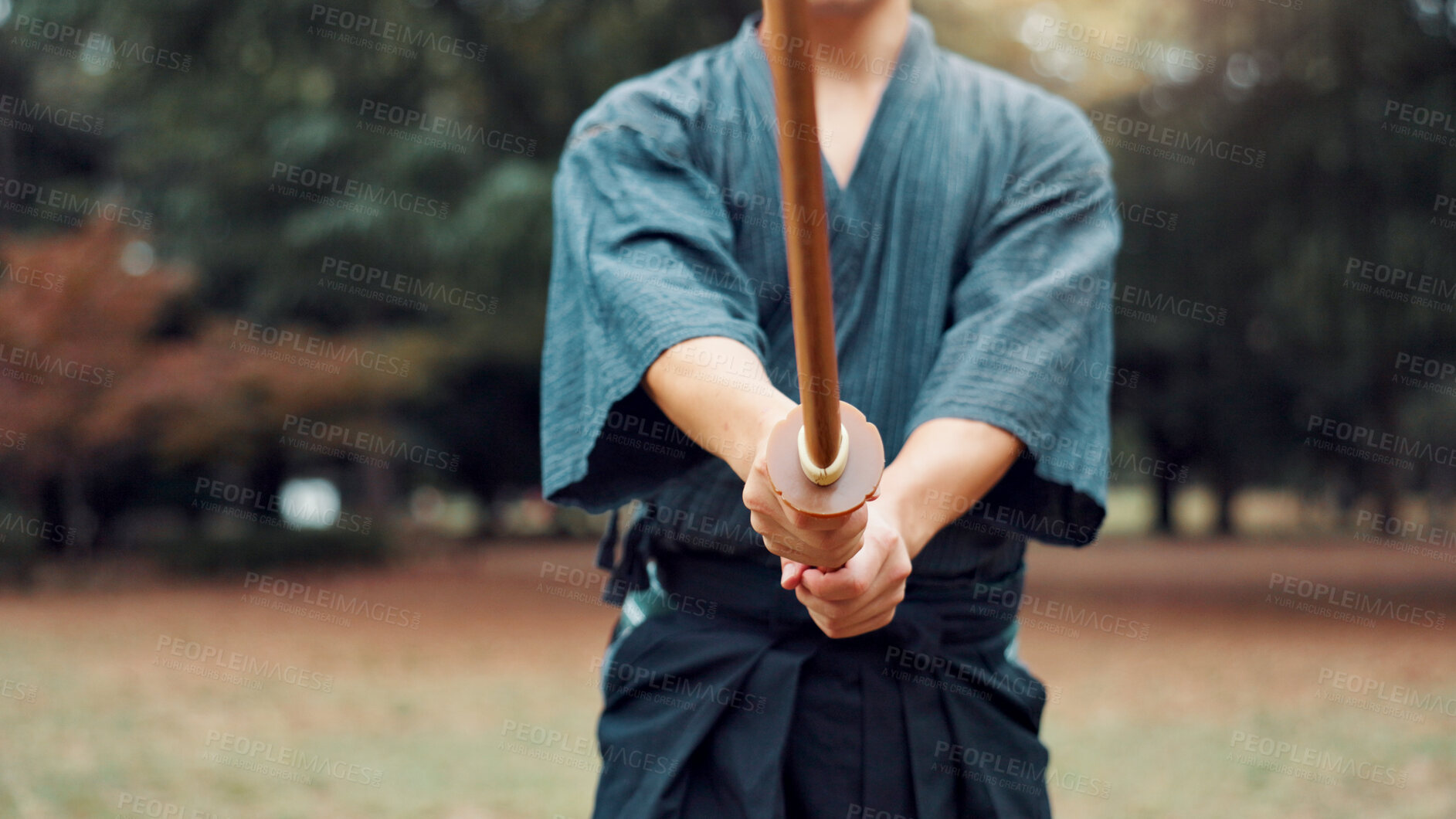 Buy stock photo Japan, training and man with bamboo sword in park for martial arts, Kendo practice and exercise. Culture, bokuto and hands of person with shinai for skills, fitness and traditional sports in nature