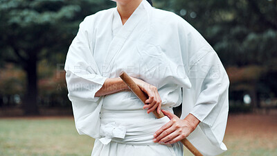 Buy stock photo Weapon, Japanese person and outdoor for martial arts in training, exercise or sports as athlete. Hands, culture and heritage for challenge, combat and practice for self defence technique with bojutsu