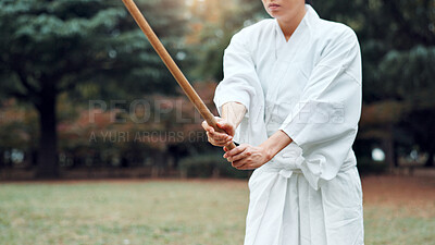 Buy stock photo Bokken, Japanese person and outdoor for martial arts in training, exercise or sports as athlete. Woman, weapon and heritage for challenge, combat and practice for self defense technique with bojutsu