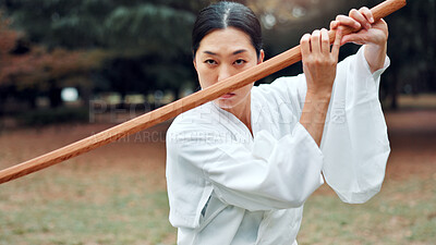 Buy stock photo Wooden sword, Japanese woman and outdoor in training, exercise or sports for martial arts. Female person, weapon and heritage for challenge, combat and practice with self defense technique in bojutsu