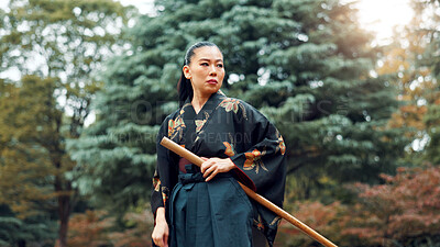 Buy stock photo Park, martial arts and Asian woman with bamboo sword in nature for training, Kendo practice and exercise. Culture, bokuto and person with shinai for skills, fitness and traditional technique in Japan