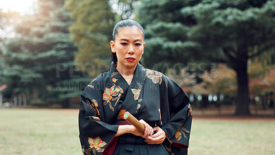 Buy stock photo Portrait, martial arts and Asian woman with bamboo sword in park for technique, Kendo practice and exercise. Culture, bokuto and person with shinai for skills, fight and traditional training in Japan