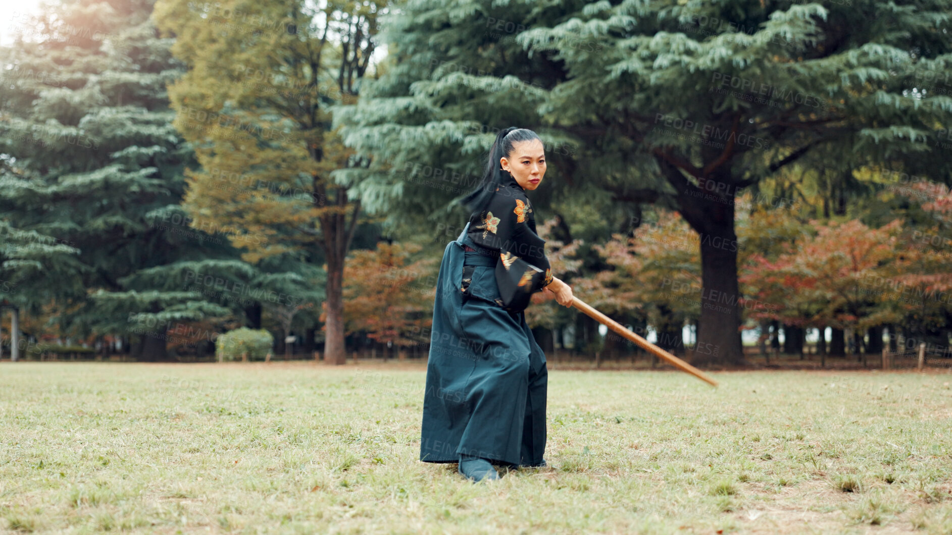 Buy stock photo Nature, fight and Asian woman with bamboo sword in park for martial arts, Kendo practice and exercise. Culture, bokuto and person with shinai for skills, fitness and traditional training in Japan