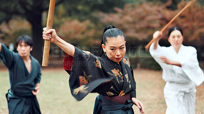 Buy stock photo Martial arts, Japanese people and instructor with wood sword for fight, battle and samurai training class. Park, ninja and mentor with weapon, kendo and warrior in autumn in Japan with fighter group