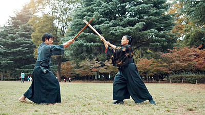 Buy stock photo Bokken, Japanese people and outdoor for martial arts in training, exercise or sports as athlete. Culture, weapon and heritage for challenge, combat and practice as self defense technique with bojutsu