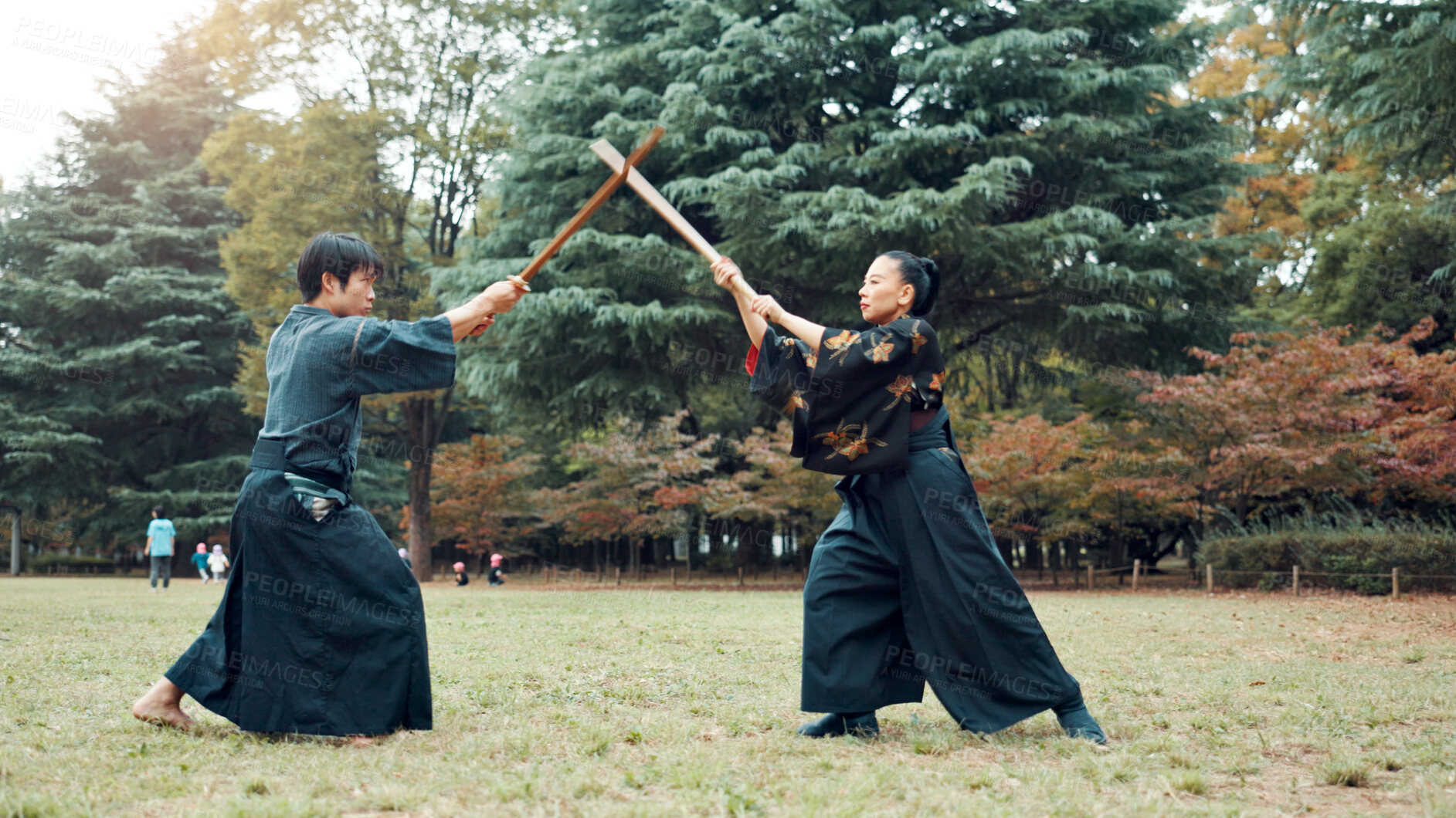 Buy stock photo Bokken, Japanese people and outdoor for martial arts in training, exercise or sports as athlete. Culture, weapon and heritage for challenge, combat and practice as self defense technique with bojutsu
