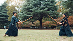 Wooden sword, Japanese people and outdoor as martial arts for training, exercise and sports. Culture, weapon and heritage for fight, combat and practice as self defense technique for bojutsu in Japan