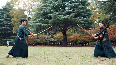 Buy stock photo Wooden sword, Japanese people and outdoor as martial arts for training, exercise and sports. Culture, weapon and heritage for fight, combat and practice as self defense technique for bojutsu in Japan