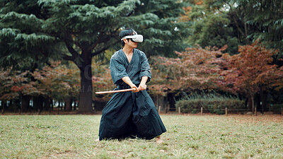 Buy stock photo Virtual reality, park and Asian man with sword for martial arts, Kendo practice and exercise. Culture, heritage and person with shinai, VR tech and goggles for skills, fight and training in Japan