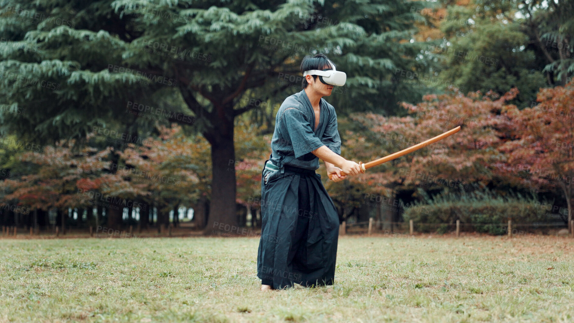 Buy stock photo Virtual reality, nature and Asian man with sword for martial arts, Kendo practice and exercise. Culture, heritage and person with shinai, VR tech and goggles for skills, fight and training in Japan