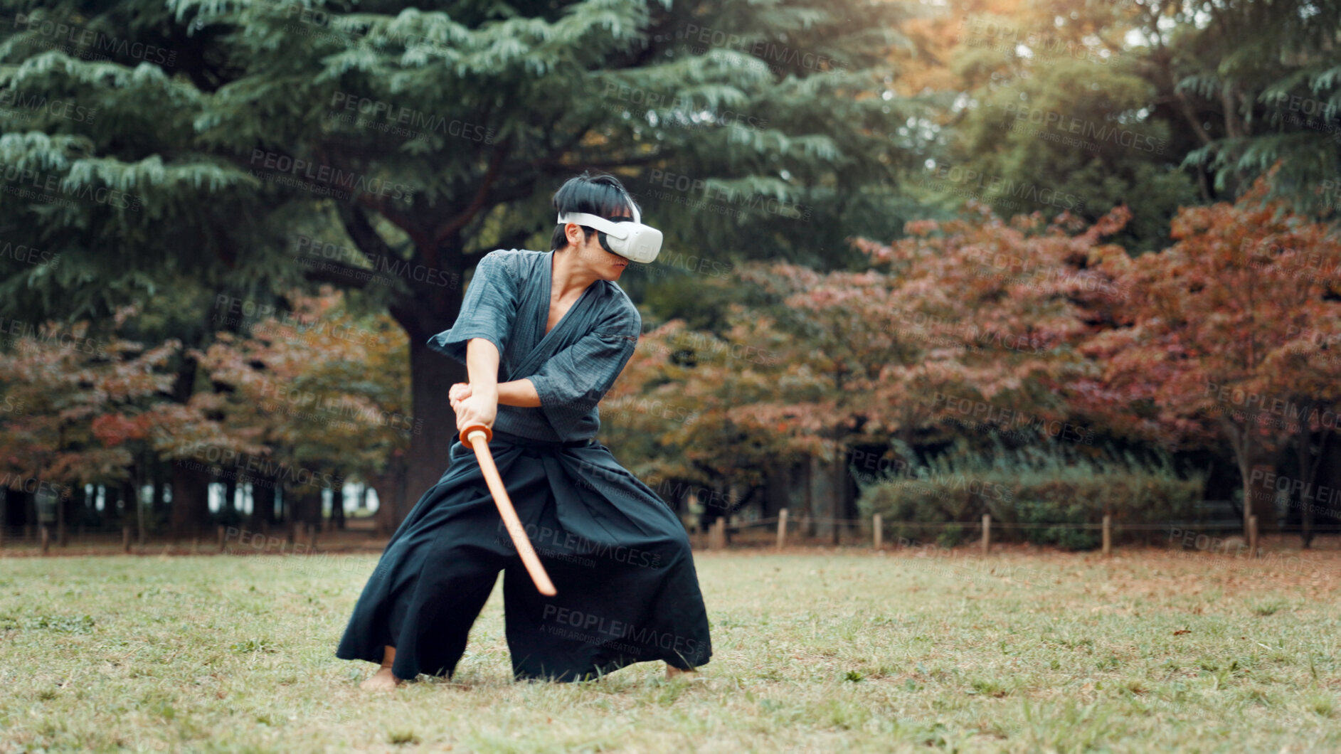 Buy stock photo Virtual reality, Japan and Asian man with sword for martial arts, Kendo practice and exercise. Culture, heritage and person with shinai, VR tech and goggles for skills, fight and training in park