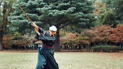 Buy stock photo Virtual reality, Japan and woman with sword for martial arts, Kendo practice and exercise. Culture, heritage and person with shinai, VR goggles and metaverse for skill, fight and training in park