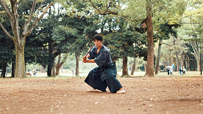 Buy stock photo Man, fitness and sword in nature for martial arts, demonstration and training tradition in Kyoto. Japanese samurai, weapon and indigenous culture in park for kendo, practice or self defense technique