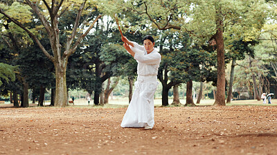 Buy stock photo Woman, fitness or sword in nature for martial arts, demonstration or training tradition in Kyoto. Japanese samurai, weapon or indigenous culture in park for kendo, practice or self defense technique