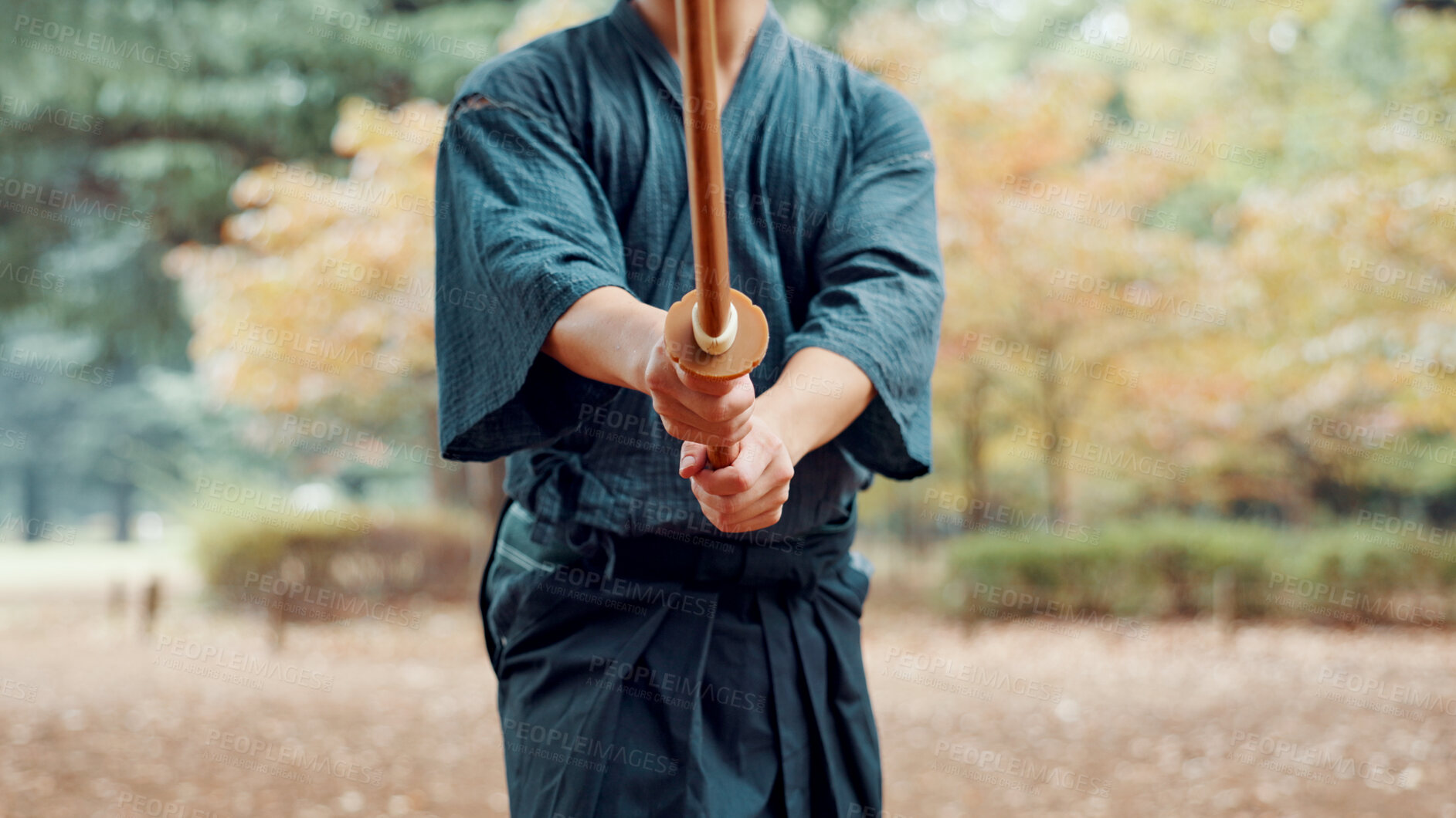 Buy stock photo Bokken, Japanese person and outdoor as practice, exercise and sport in culture or martial arts. Performance, weapon and heritage for challenge, combat or training as self defense technique in bojutsu