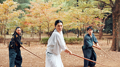 Buy stock photo Martial arts, students and instructor outdoor with wood sword for fight, battle and samurai training class. Park, ninja and mentor with weapon, kendo and warrior in autumn in Japan with fighter group