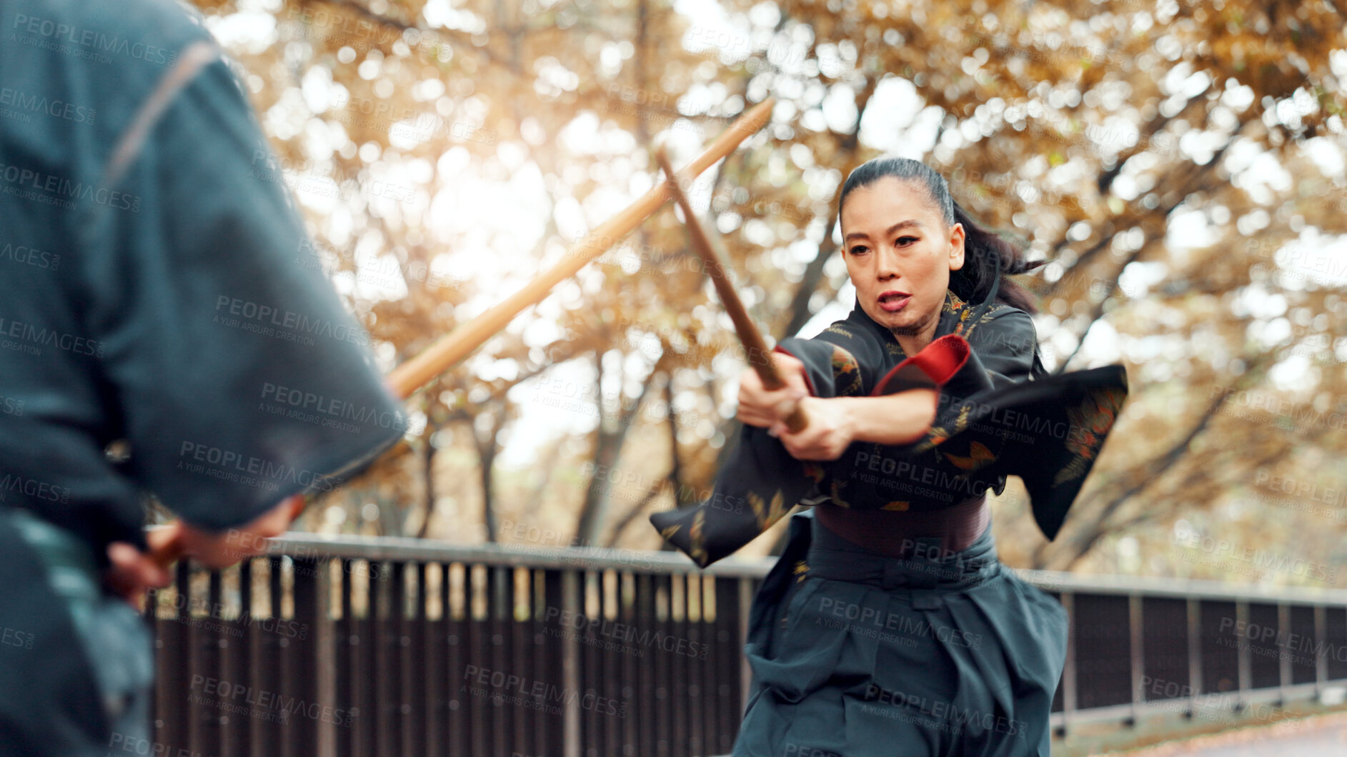 Buy stock photo Trainer, bamboo sword and Asian woman in city for martial arts, Kendo practice and exercise. Culture, Japan heritage and person and sensei with shinai, bokuto and weapon for skill, fight and training