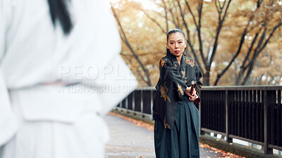 Buy stock photo Battle, fighter and woman with weapon, martial arts and kimono for training, outdoor and aikido. Woods, fitness and person with skills for bamboo sword, technique and discipline for kendo in Japan