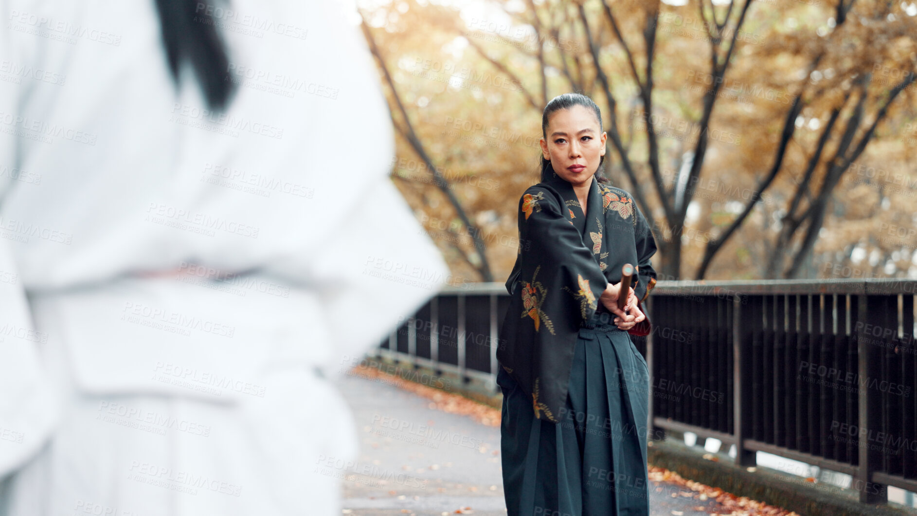 Buy stock photo Battle, fighter and woman with weapon, martial arts and kimono for training, outdoor and aikido. Woods, fitness and person with skills for bamboo sword, technique and discipline for kendo in Japan