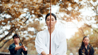 Buy stock photo Sensei, bamboo sword and Asian people for martial arts, Kendo practice and exercise in park. Culture, teaching and men and women with shinai, bokuto and weapon for skill, fight and training in Japan