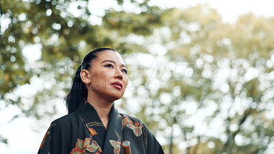 Buy stock photo Woman, thinking and reflection in park for peace, idea and mindset for martial arts practice in Tokyo. Japanese samurai, daydreaming and relax in nature with nostalgia, memories and culture in sport