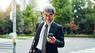 Buy stock photo Outdoor, businessman and happy on smartphone on internet for stock exchange rates in Japan. Mature person, city and smile as employee in finance on mobile app for market share or trading returns
