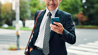 Buy stock photo Outdoor, businessman and smile on smartphone on internet for stock exchange rates in Japan. Mature person, city and happy as employee in finance on mobile app for market share or trading returns