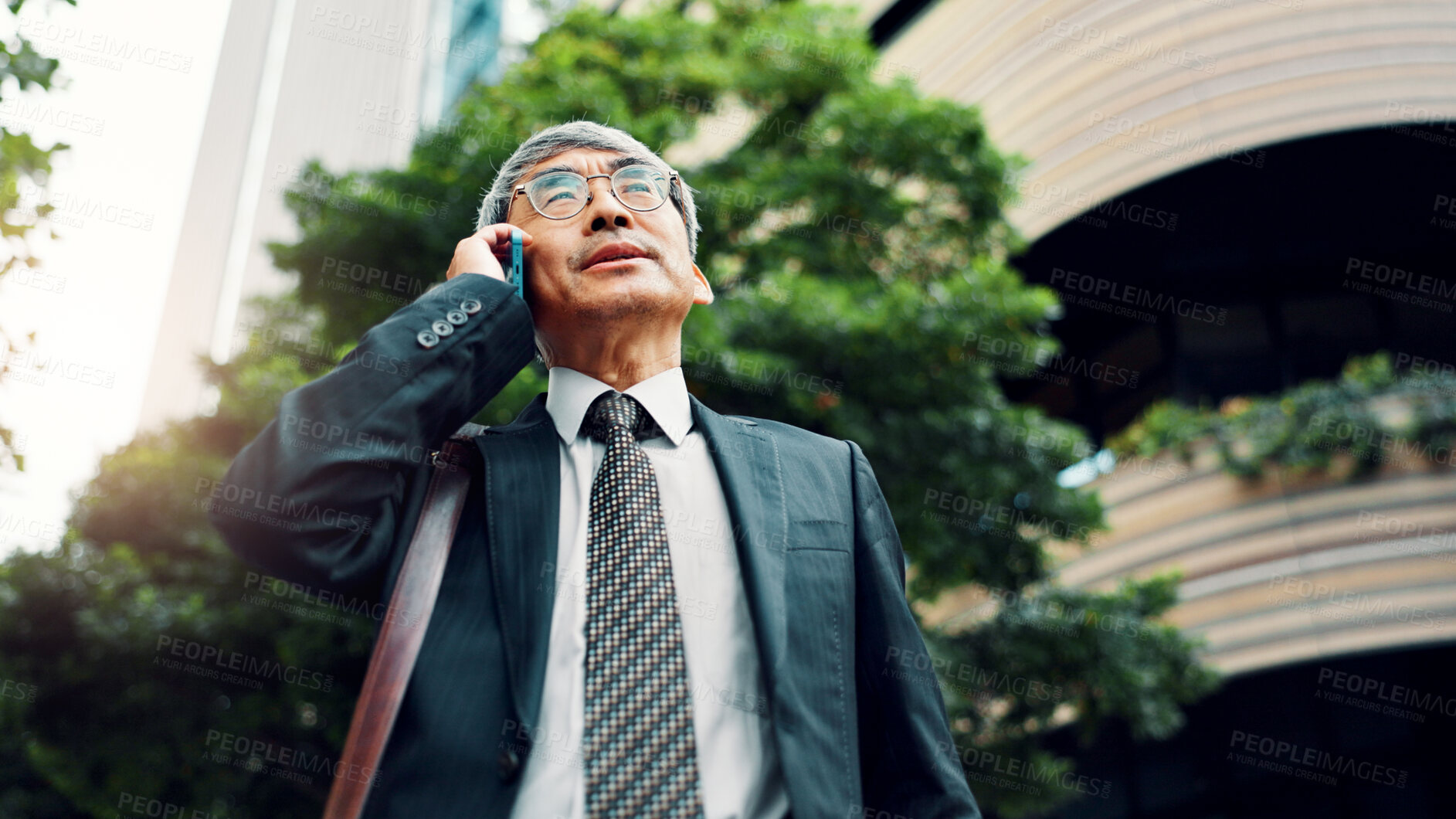 Buy stock photo Japan, phone call and business with man, outdoor and conversation with digital app. Mature person, employee and accountant in city, smartphone and chatting with communication, morning and discussion