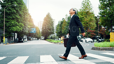 Buy stock photo Mature, business man and walking in street for morning commute, journey to work or sightseeing with briefcase. Japanese professional, crosswalk or trip to job, corporate travel or destination in city