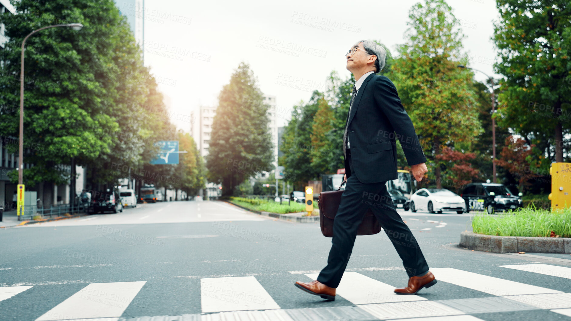 Buy stock photo Mature, business man and walking in street for morning commute, journey to work or sightseeing with briefcase. Japanese professional, crosswalk or trip to job, corporate travel or destination in city