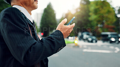 Buy stock photo Hands, business and man with phone in city for communication, planning travel and schedule update. Mature, person and mobile app with corporate negotiation, location research and information in Japan