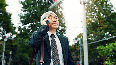 Buy stock photo Japan, phone call and business with mature man, travel and conversation with digital app. Asian person, employee and accountant in city, cellphone and mobile user with communication, talk or chatting