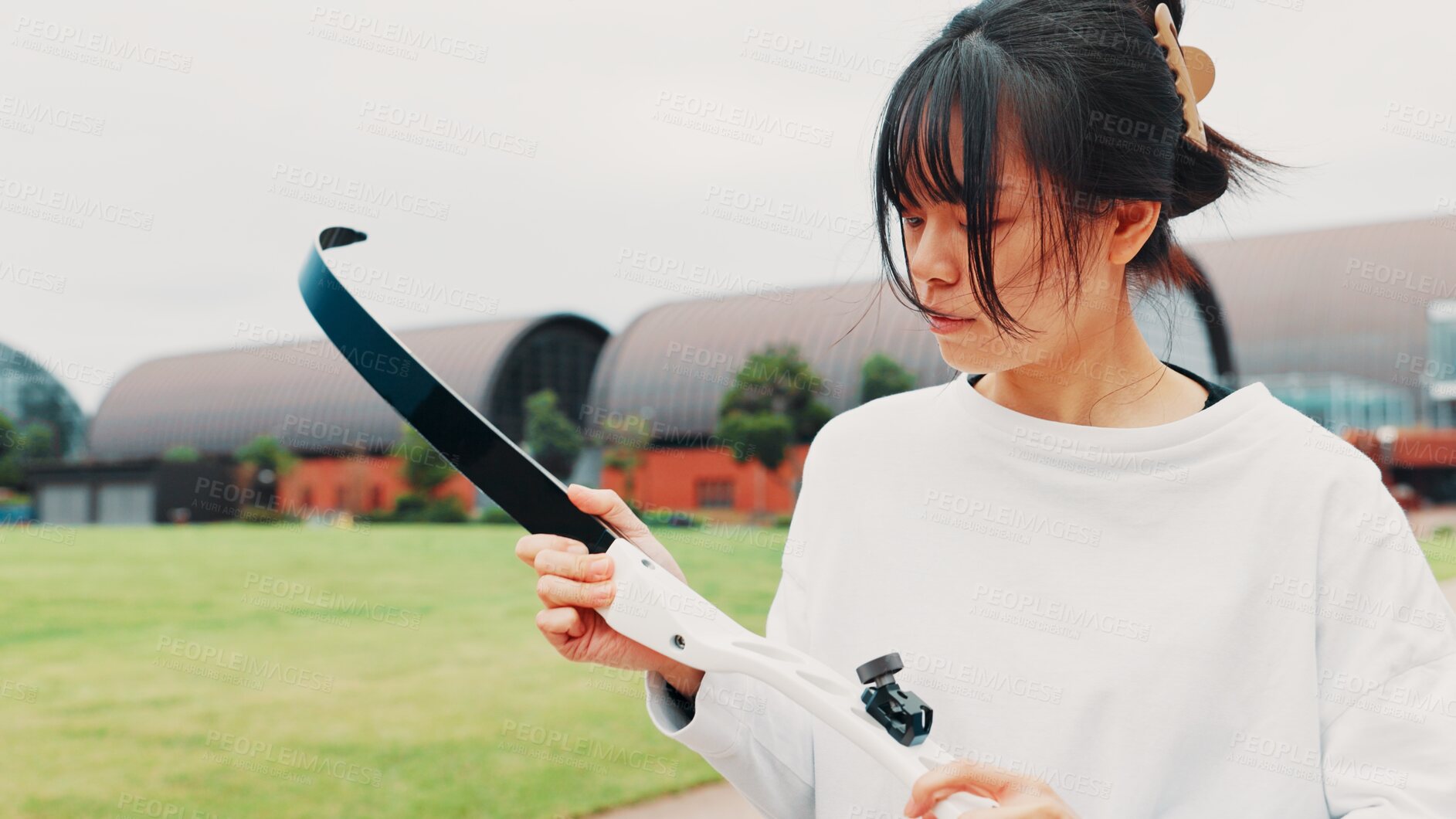 Buy stock photo Archery, sport and woman with bow on field for shooting practice, martial arts tradition or getting ready. Japanese culture, archer and equipment safety for kyudo, precision lesson or target training