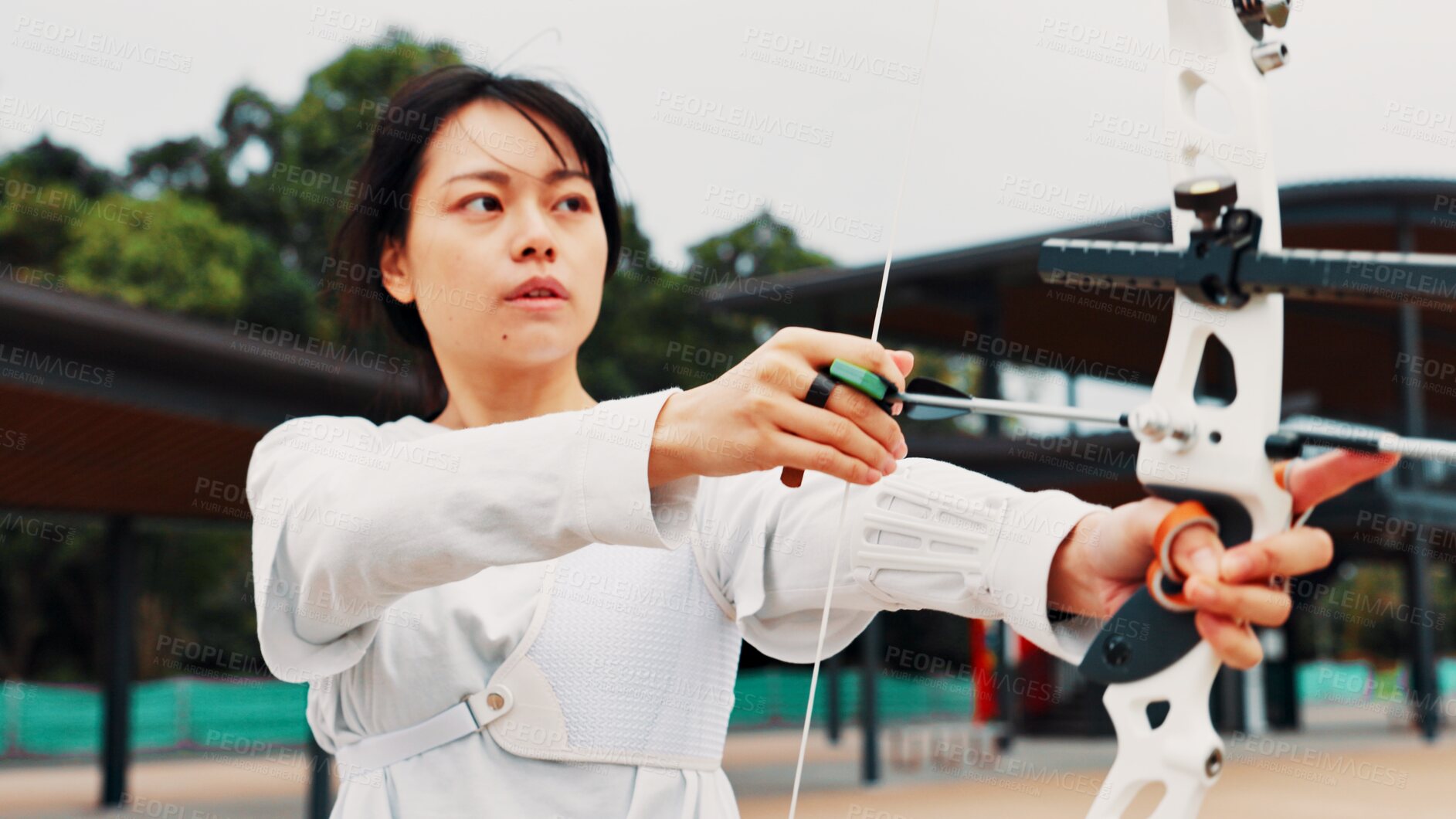 Buy stock photo Woman, archer and bow for training, shooting and preparing for competition, equipment and outdoor. Contest, athlete and practice from tournament, skills and challenge for person, game and Japan