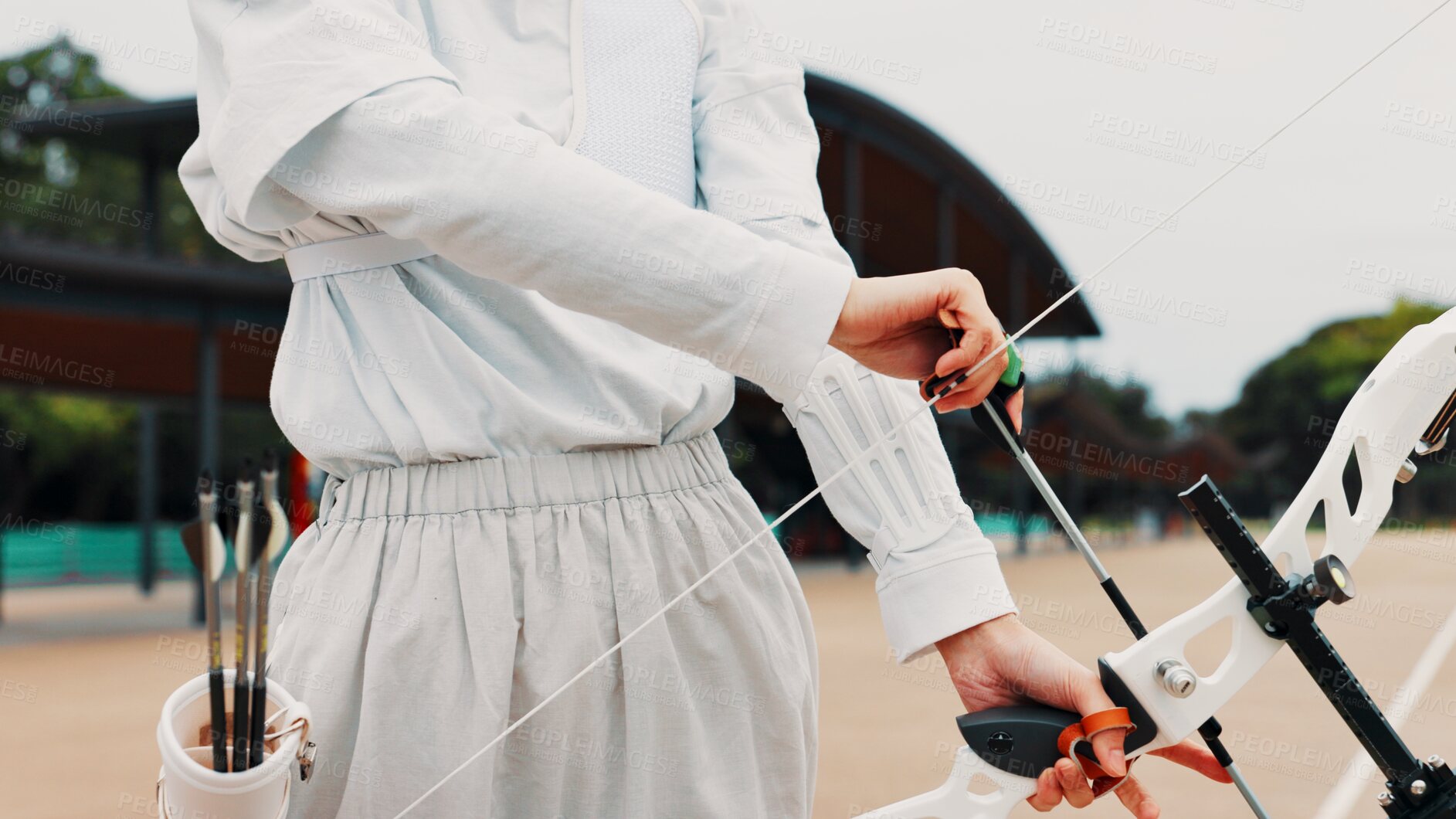 Buy stock photo Hands, ready and bow for training, archery and preparing for competition, equipment and outdoor for game. Contest, athlete and practice from tournament, skills and challenge for person in Japan