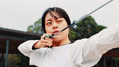 Buy stock photo Woman, archery and arrow at field with sport for shooting practice and training as athlete in Japan. Tournament, female person and setup recurve bow or equipment for challenge, game  and competition 